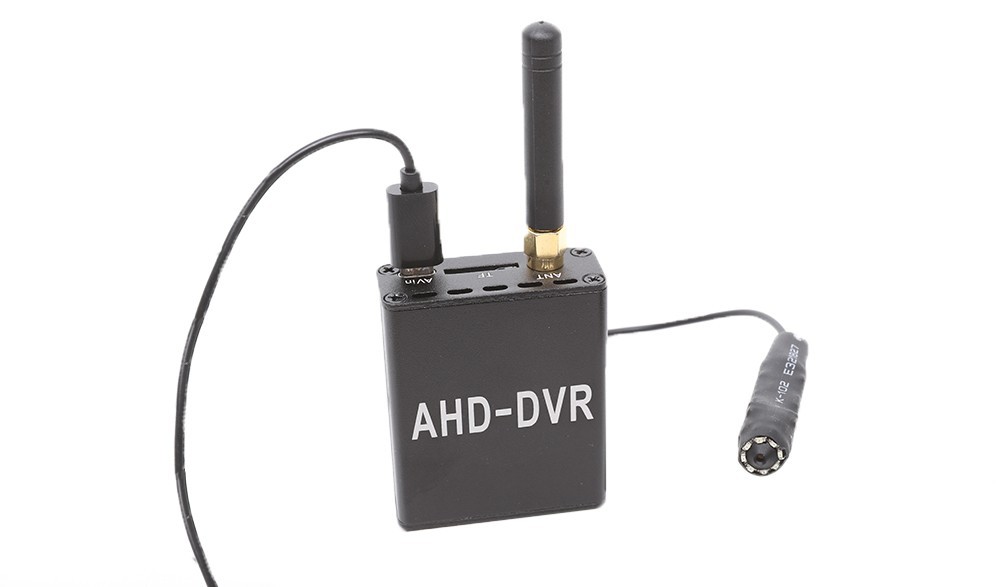 Wireless button camera with sales receiver